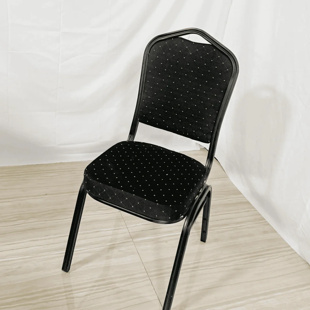 Black stackable banquet chairs featuring an arched crown-back backrest with diamond-patterned tufted upholstery, a thick padded seat cushion, a built-in top carrying handle, and a durable black metal frame.