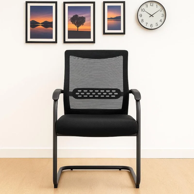 Mid-back mesh waiting chair featuring a rectangular black mesh backrest with a perforated horizontal lumbar support band, fixed curved armrests, a padded black fabric seat, and a black metal cantilever sled base.