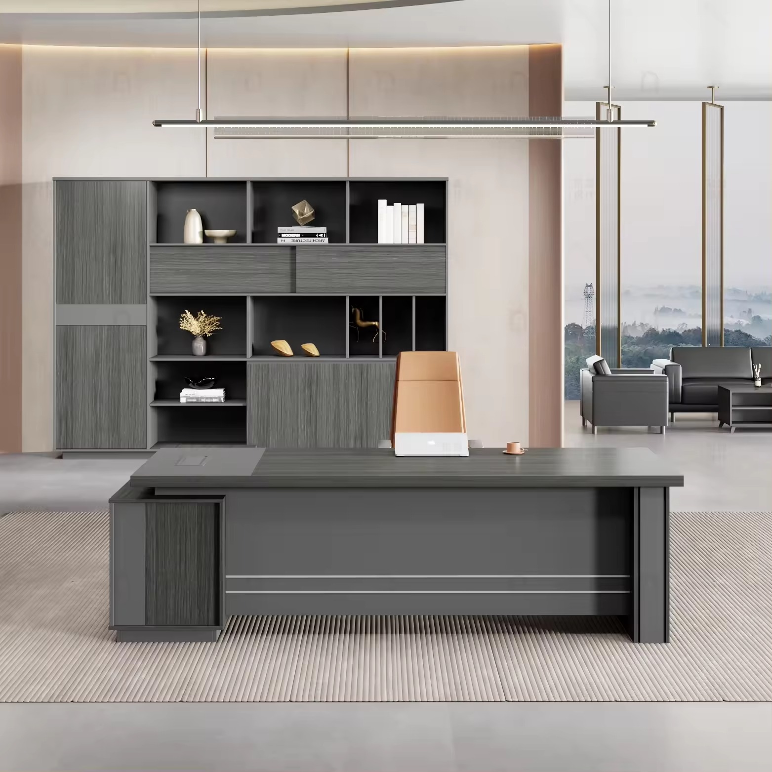 Modern L-shaped executive desk in a sleek gray wood grain finish, featuring a thick floating tabletop design supported by a dark charcoal sub-frame, a matching integrated side return storage cabinet, and a metallic-trimmed gray modesty panel.