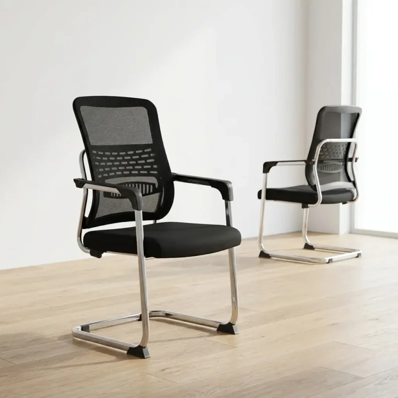 Ergonomic black mesh visitor chair with a chrome cantilever base, breathable backrest, and padded seat for professional office reception and meeting rooms.