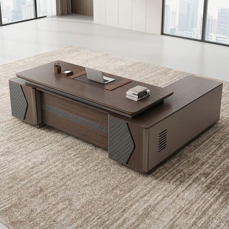 2.4m L-shaped office table featuring a premium dark walnut veneer finish, a floating desktop design with rounded corners, a built-in brown leather writing pad, an integrated right-hand return credenza side unit, and a decorative front modesty panel accented with diamond-quilted grey leather padding.