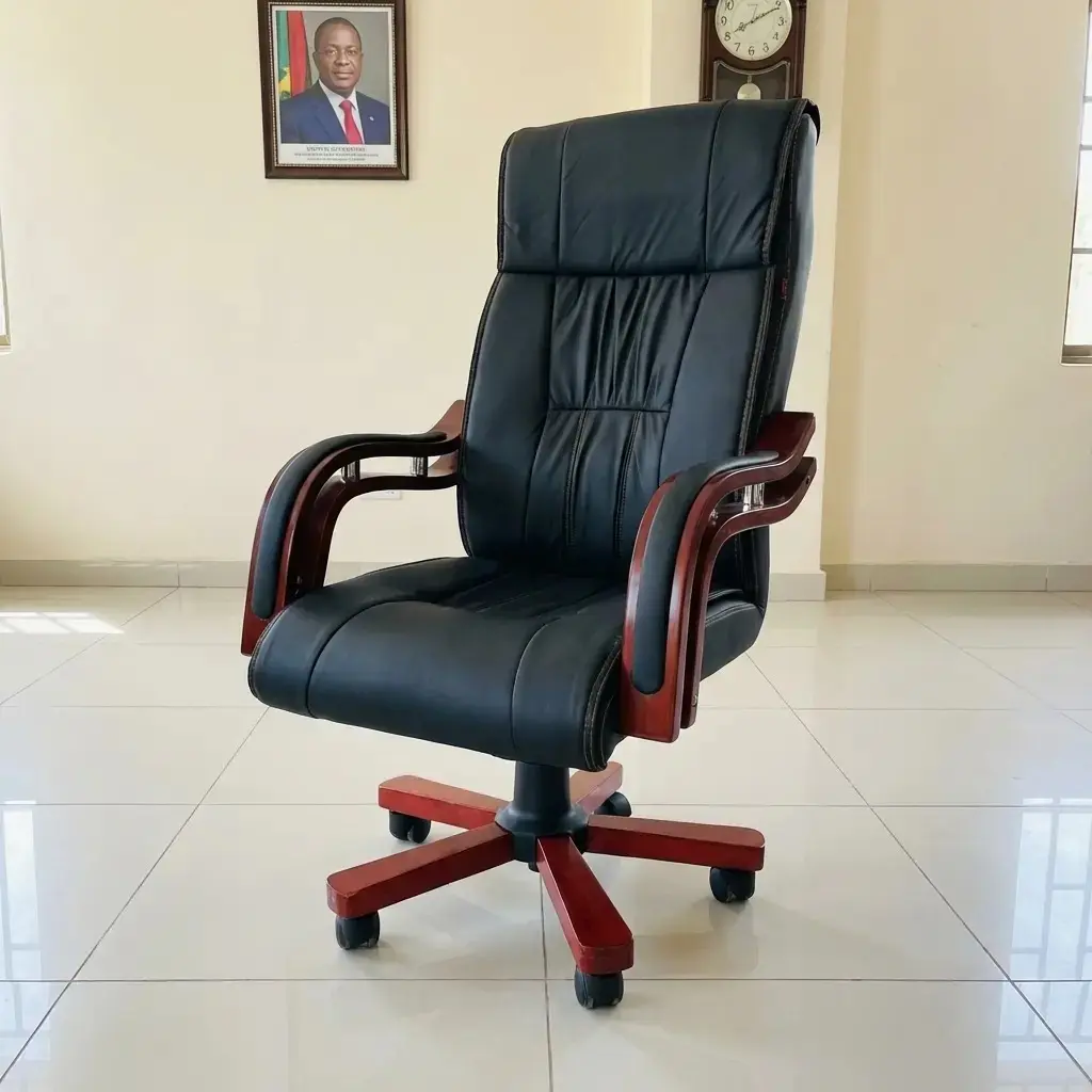 Luxurious high-back executive office chair in premium black leather with elegant mahogany-finish wood armrests and a matching five-star swivel base, set in a professional minimalist office.
