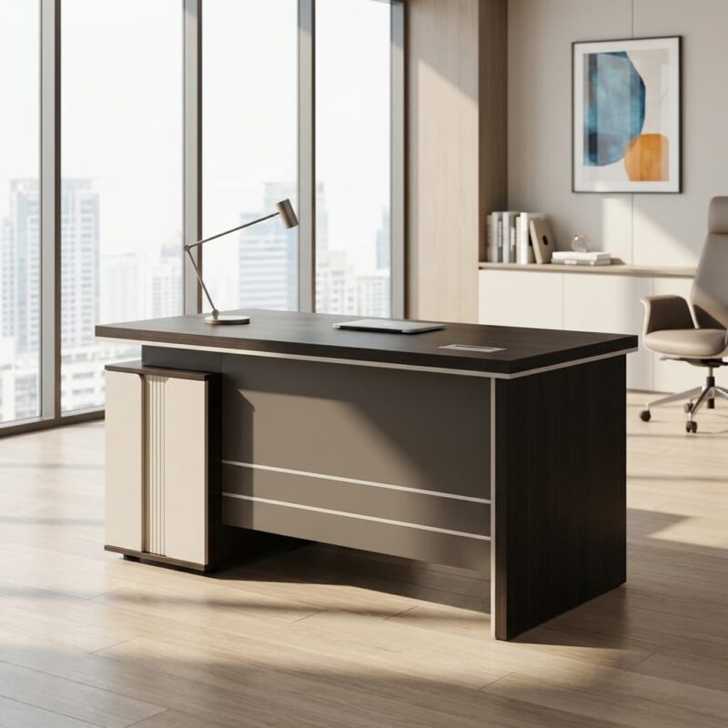 A compact wooden executive desk in a reddish-brown finish with carved front panels.