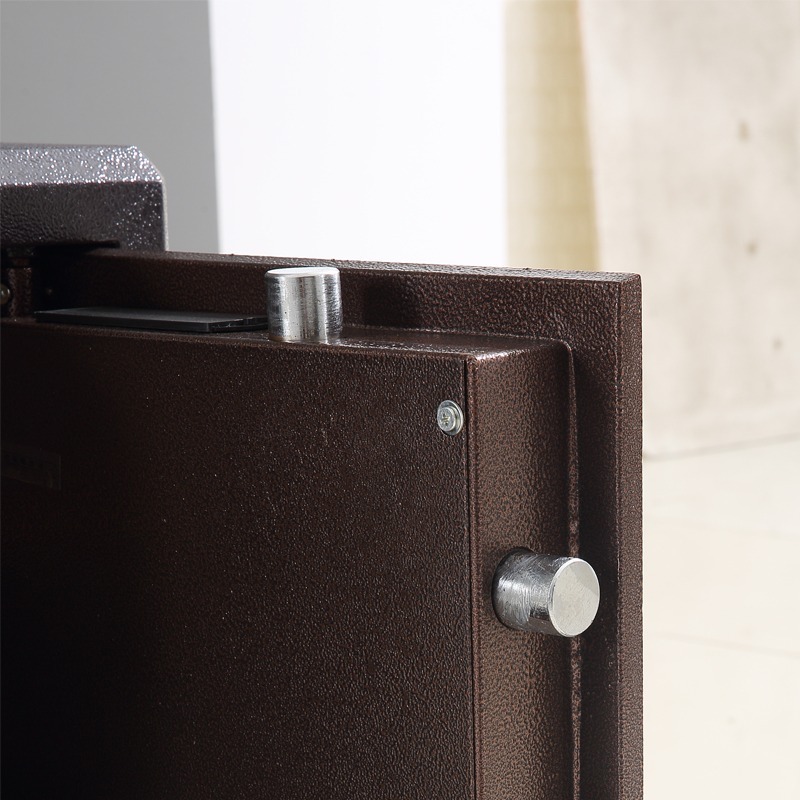 70kg fireproof safe box in a metallic bronze finish, featuring an open thick-rimmed steel door with four heavy locking bolts, a white geometric-patterned inner door lining, two adjustable internal shelves, and an upper locking privacy compartment.