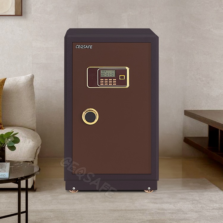 70kg fireproof safe box in a metallic bronze finish, featuring an open thick-rimmed steel door with four heavy locking bolts, a white geometric-patterned inner door lining, two adjustable internal shelves, and an upper locking privacy compartment.