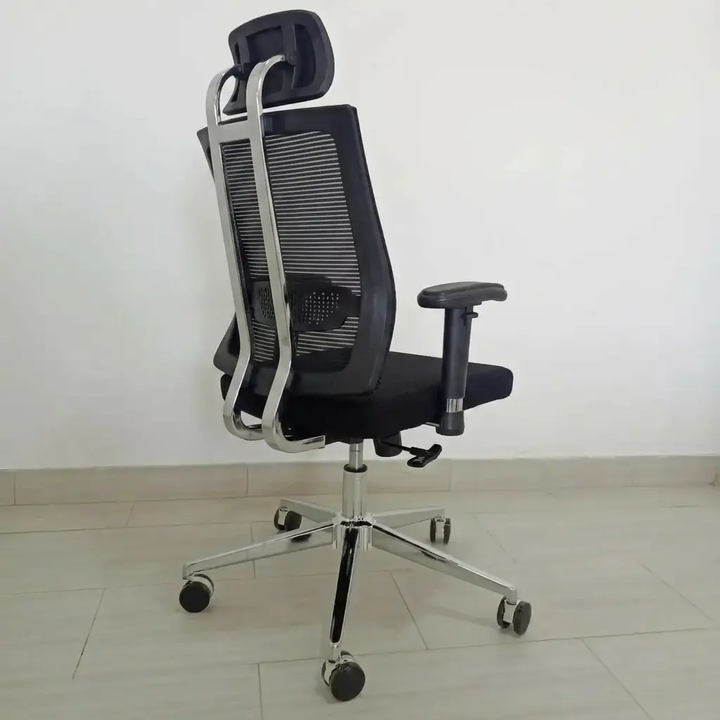 High-back orthopedic ergonomic office chair with breathable mesh backrest, adjustable headrest, and chrome swivel base.