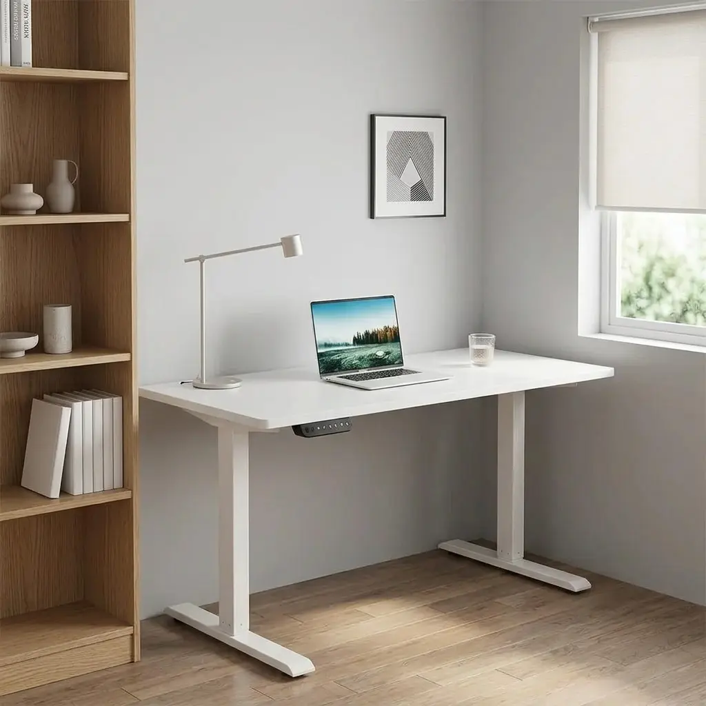 1.4m white height adjustable standing desk for home offices with electric lift system and modern minimalist T-frame.