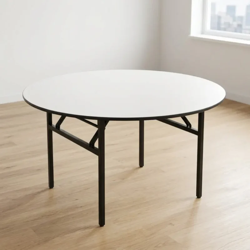 1.5m round conference table with a white laminate top, black protective edge banding, and heavy-duty folding metal legs for flexible office meeting rooms.