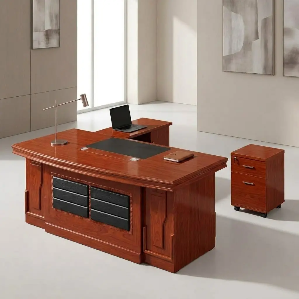 Modern 1600mm executive office desk featuring a warm brown wood grain tabletop with an integrated gray writing blotter inlay, a sleek gray side return cabinet, and gold horizontal accents on the front modesty panel.