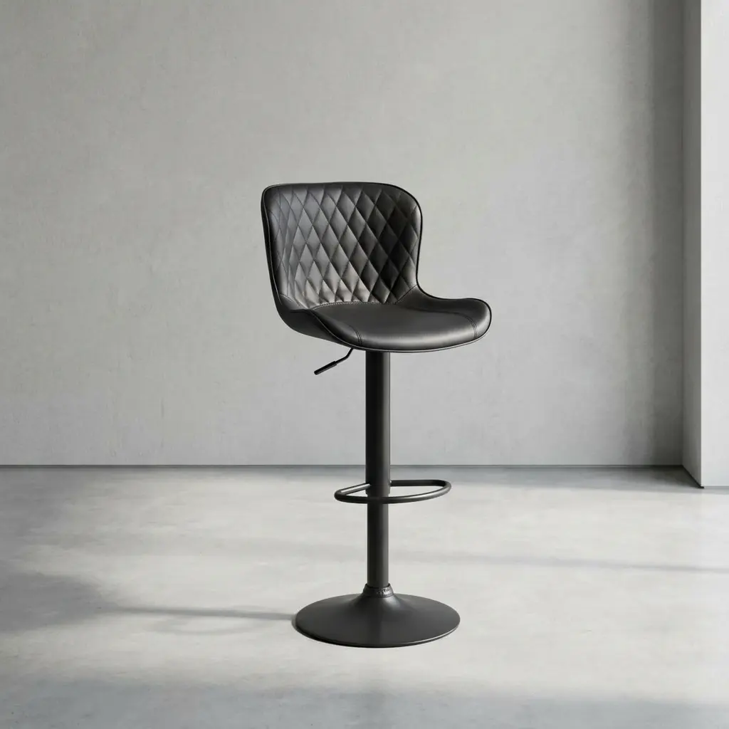 Height adjustable swivel barstool featuring a black faux leather bucket seat with diamond-quilted tufting on the backrest, an under-seat gas lift adjustment lever, a built-in oval footrest, and a matte black metal pedestal base.
