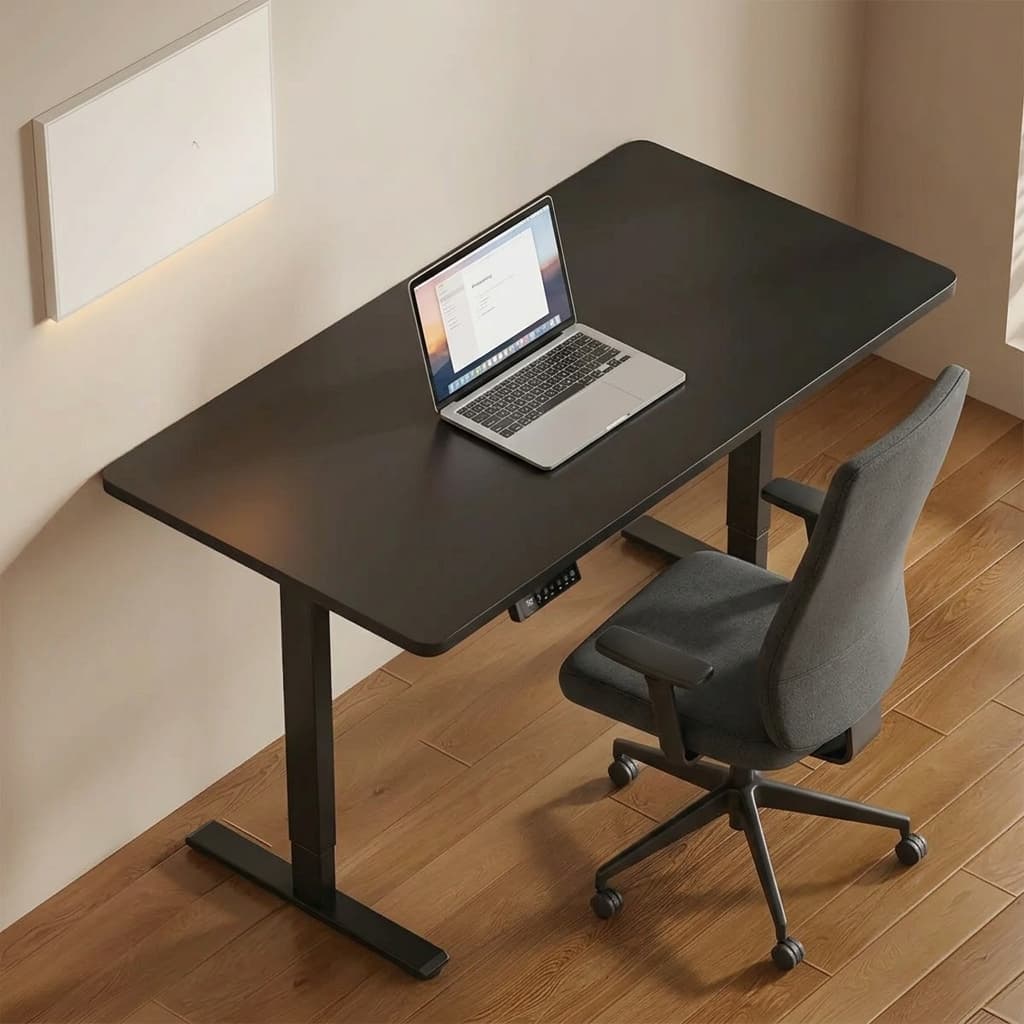 Black electric standing desk with height-adjustable T-leg frame and integrated digital control panel.