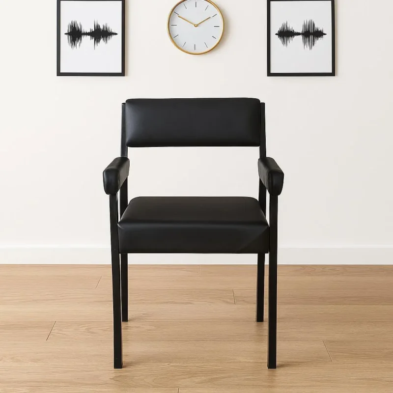 Modern black leather Catalina training chair featuring a minimalist rectangular padded backrest, thick upholstered armrests, a cushioned square seat, and a matte black four-legged metal frame.