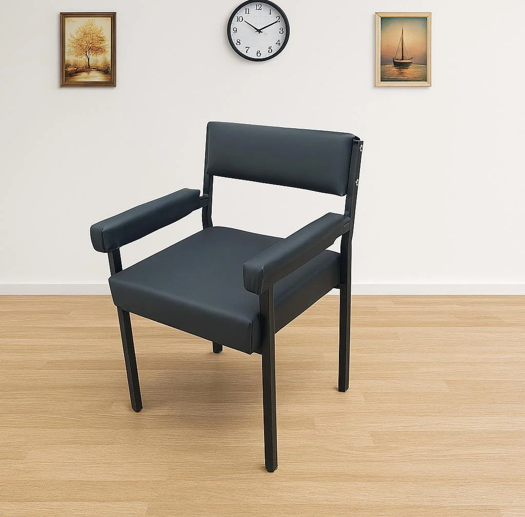Modern black leather Catalina training chair featuring a minimalist rectangular padded backrest, thick upholstered armrests, a cushioned square seat, and a matte black four-legged metal frame.