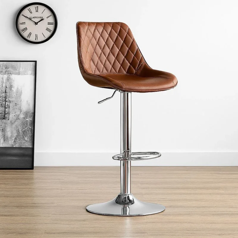 Vintage-style brown leather adjustable barstool featuring a diamond-quilted upholstered bucket seat, a pneumatic gas lift adjustment lever, and a polished chrome pedestal base with an integrated circular footrest.