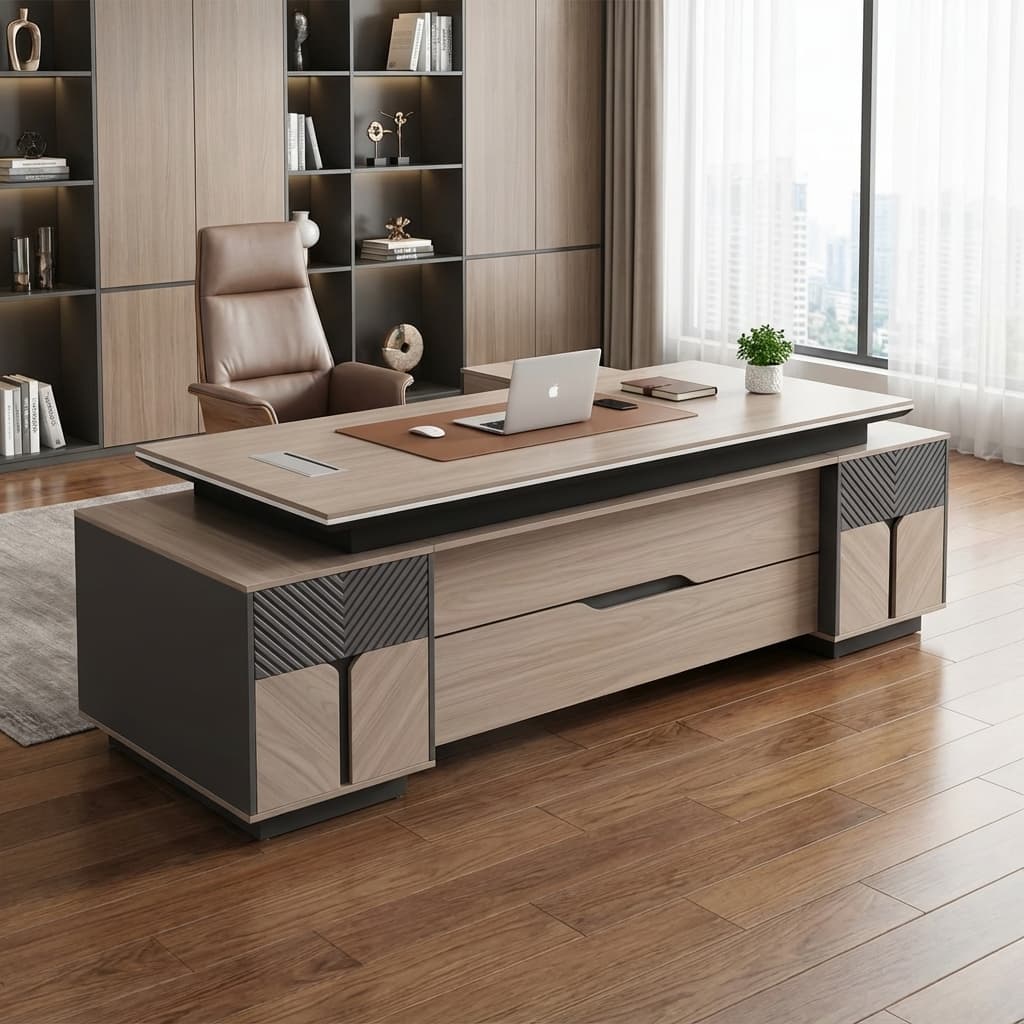 2.4m managerial executive desk in an L-shaped configuration featuring a light oak wood grain melamine floating tabletop with an embedded silver rectangular cable flip-box, an integrated charcoal grey side return credenza, and a textured front modesty panel accented with fluted dark grey panels and wood-toned cabinet facades.