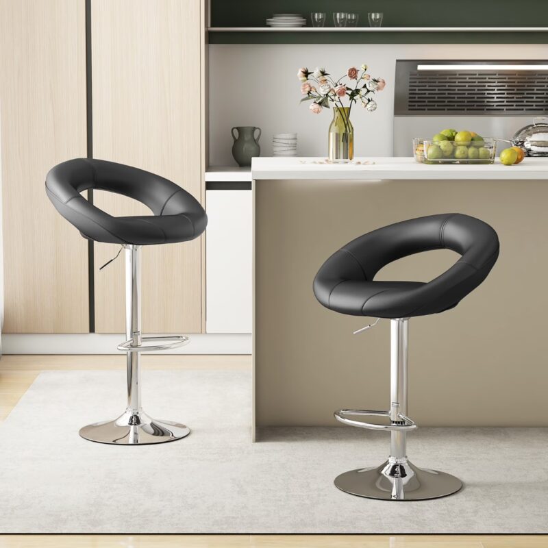 Leather Adjustable Bar Stools in a pair, featuring a unique hollow circular backrest design upholstered in smooth black faux leather, a cushioned swivel seat, and a gas-lift lever mechanism on a polished chrome pedestal base with an integrated teardrop footrest.