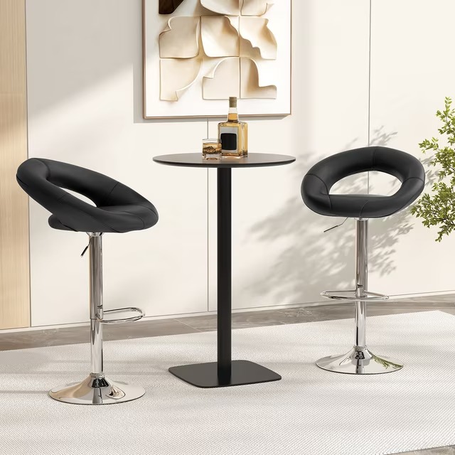 Leather Adjustable Bar Stools in a pair, featuring a unique hollow circular backrest design upholstered in smooth black faux leather, a cushioned swivel seat, and a gas-lift lever mechanism on a polished chrome pedestal base with an integrated teardrop footrest.