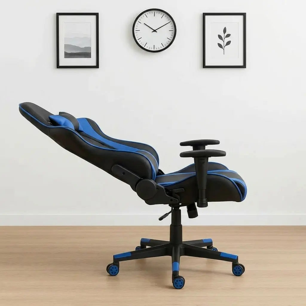 Ergonomic high-back gaming chair in black and blue leather, featuring matching adjustable lumbar support, a neck pillow, fixed T-shaped armrests, and a 5-star swivel star base with blue-trimmed caster wheels.