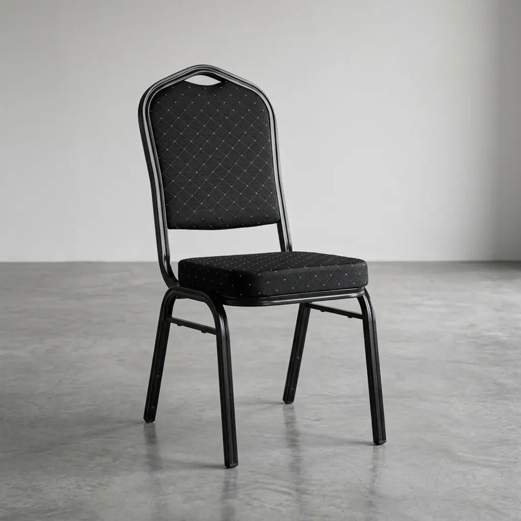 Stackable black banquet conference chair featuring a diamond-patterned fabric upholstered backrest and seat cushion, a crown-back metal frame with an integrated carrying handle, and sturdy black legs on a concrete floor.