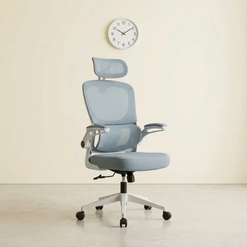 White ergonomic office chair featuring a contoured mesh headrest, a light grey or slate blue breathable mesh backrest with an integrated lower lumbar cushion, flip-up padded armrests with white frames, a matching padded fabric seat cushion, and a five-star white nylon swivel base on dual-wheel casters.