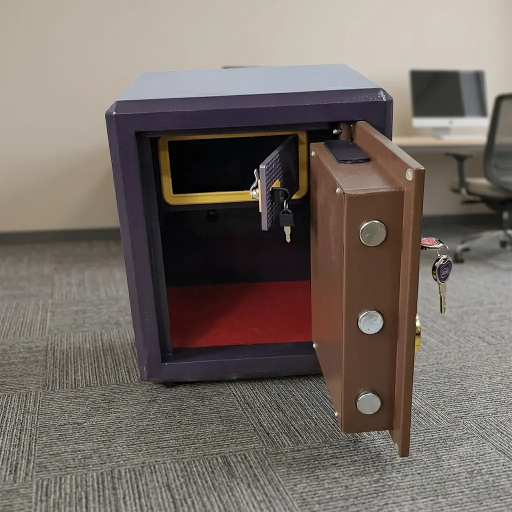 30kgs fireproof safe box featuring a heavy-duty steel body with a textured dark bronze outer frame, a gold-trimmed electronic digital keypad panel, a central LCD screen display, a gold circular mechanical dial, and a dual-key override lock system with keys inserted.