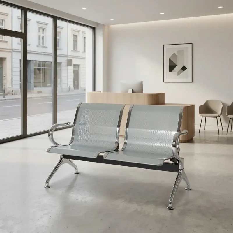 2-seater steel waiting bench featuring two contoured light grey perforated metal seats with polished chrome borders, an underlying black metal horizontal support beam, and curved chrome armrests matching the angled chrome legs with adjustable leveling feet.