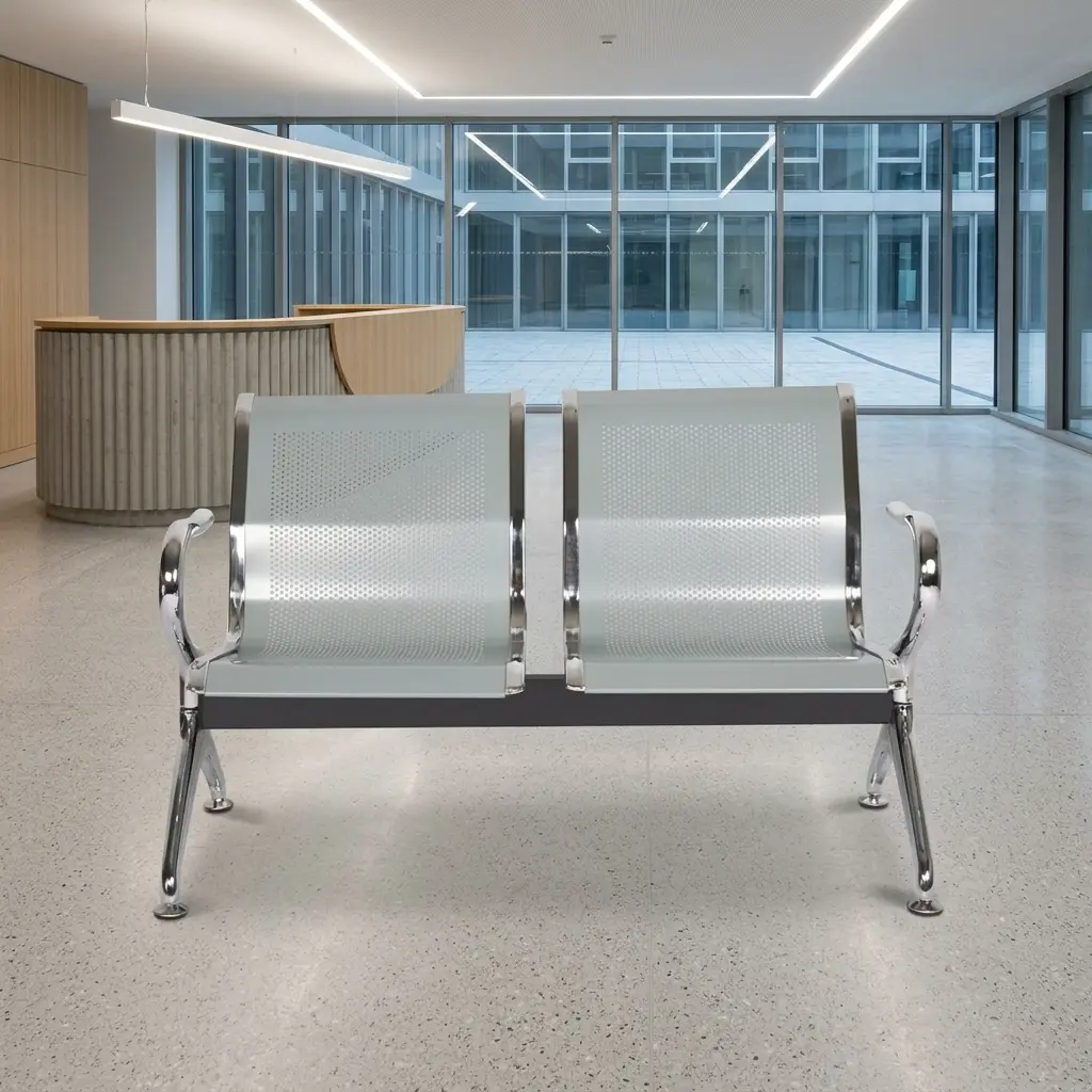 2-seater steel waiting bench featuring two contoured light grey perforated metal seats with polished chrome borders, an underlying black metal horizontal support beam, and curved chrome armrests matching the angled chrome legs with adjustable leveling feet.