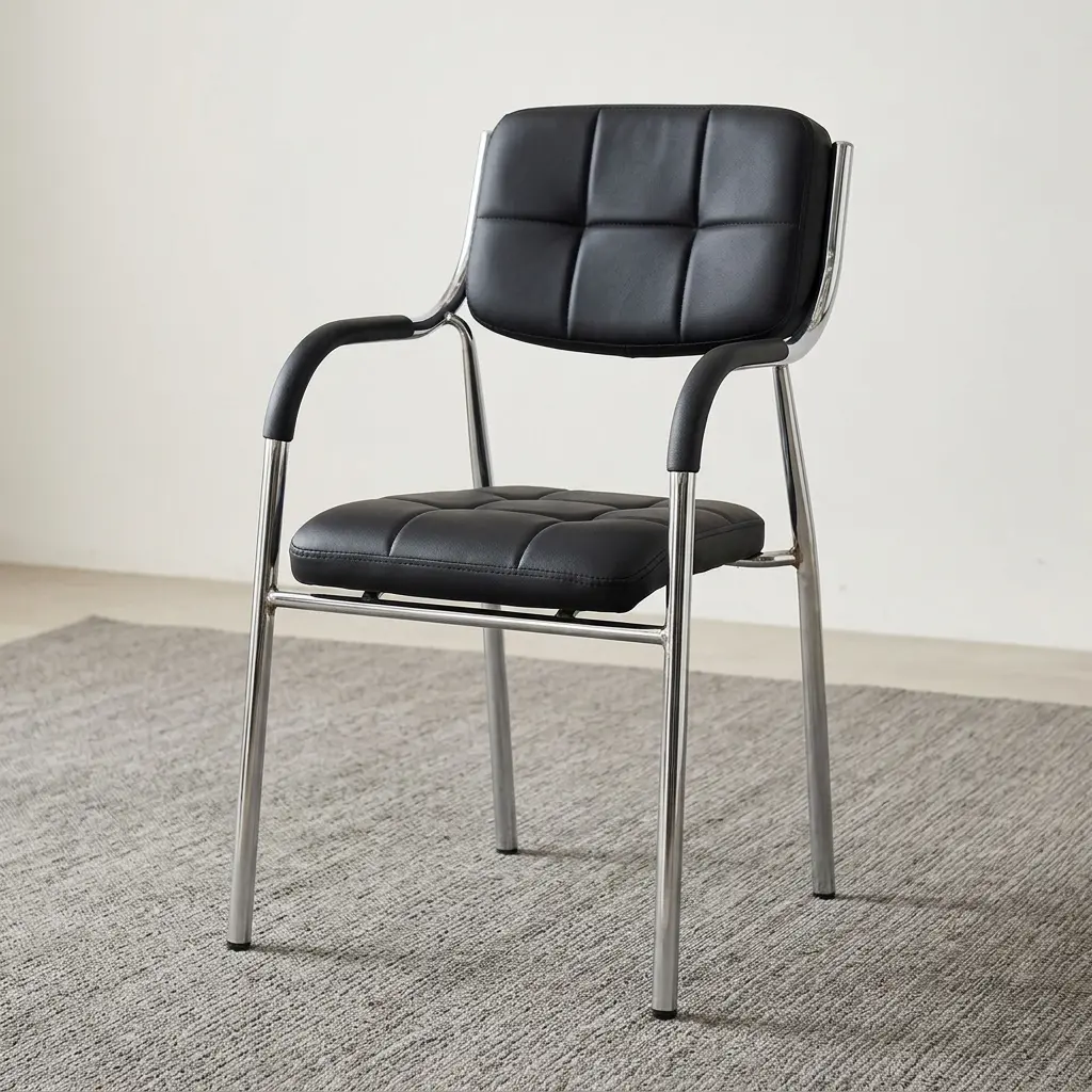 Low-back Catalina office chair featuring a padded seat and backrest upholstered in grid-tufted black leatherette, black padded sleeve armrests, and a sleek chrome tubular metal frame with integrated four-legged support.