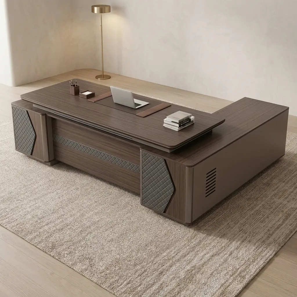 2.4m L-shaped office table featuring a dark walnut wood-grain desktop with an integrated leatherette writing pad inlay, a front modesty panel decorated with a horizontal quilted accent band, side support pillars with grey diamond-quilted panels, and an extended side return credenza with ventilation slots and integrated storage.