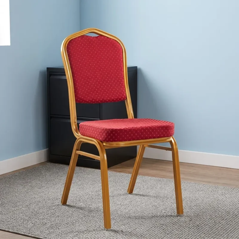 Fabric Red Conference Chair featuring a crown-back gold-finished metal frame, padded seat and backrest upholstered in red patterned fabric with gold dot detailing, and four fixed legs with protective floor glides.