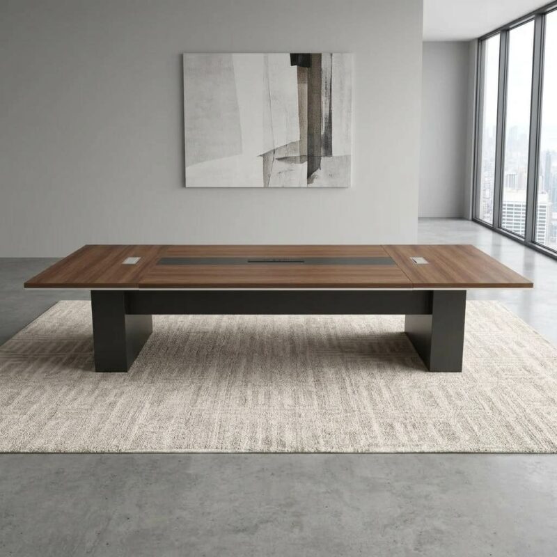 3.5m meeting conference table featuring a rich walnut wood laminate finish, a dark grey central inset accent panel, integrated pop-up cable management modules, and heavy-duty dark grey slab pedestal bases.