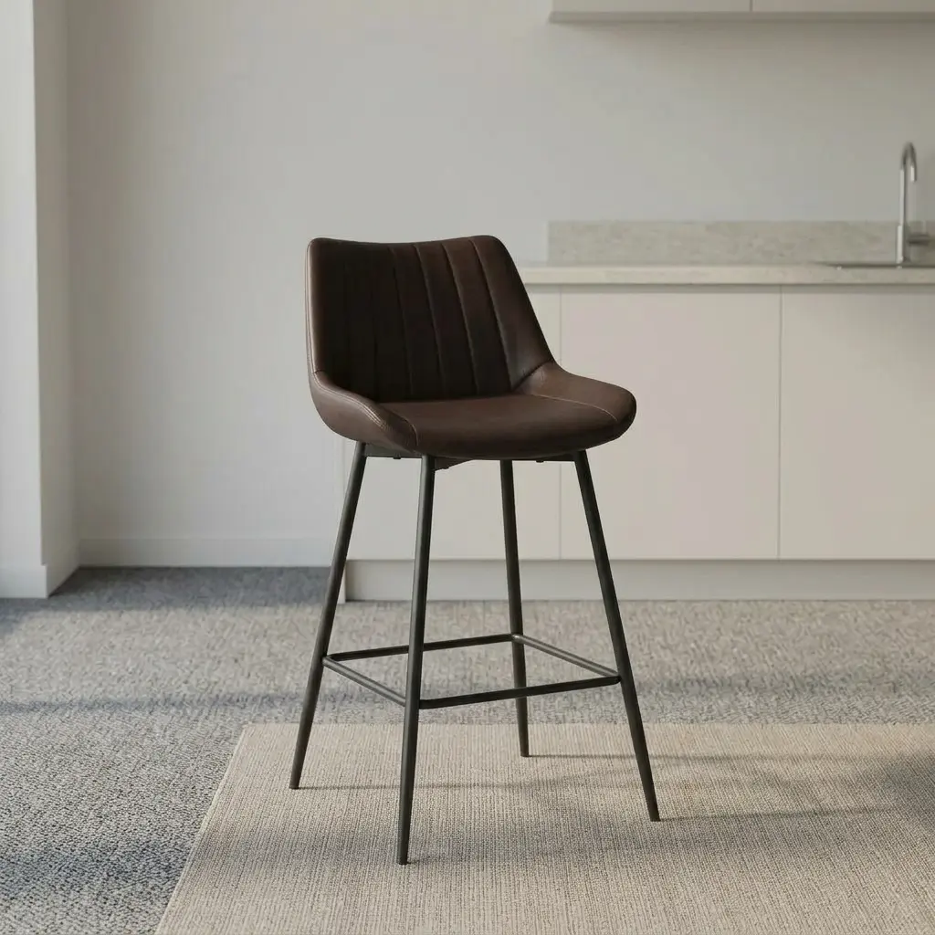 Leather kitchen bar stool featuring rich dark brown faux leather upholstery with vertical channel stitching, a low-profile contoured backrest, and slim, tapered matte black metal legs with an integrated footrest frame.