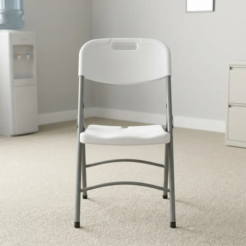 Plastic white foldable chair featuring a molded high-density resin seat and backrest, an integrated handle cutout for easy transport, ergonomic seat contouring, and a grey powder-coated tubular steel frame with protective non-marring foot caps.