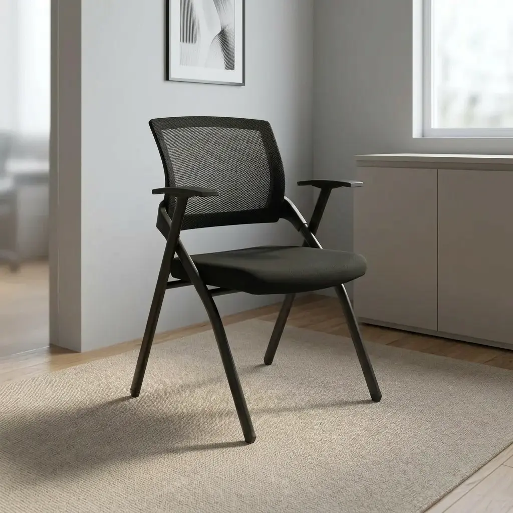 Black foldable office chair featuring a breathable black mesh backrest, contoured high-density foam seat upholstered in black fabric, integrated T-style armrests, and a collapsible matte black powder-coated metal frame.