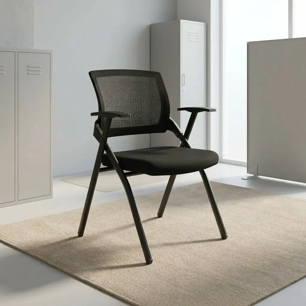 Black foldable office chair featuring a breathable black mesh backrest, contoured high-density foam seat upholstered in black fabric, integrated T-style armrests, and a collapsible matte black powder-coated metal frame.