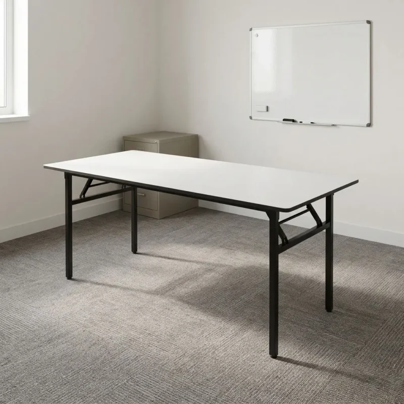 White foldable training table featuring a sleek rectangular white laminate tabletop, supported by a heavy-duty black powder-coated steel frame with collapsible legs and cross-bar locking mechanisms for easy storage.