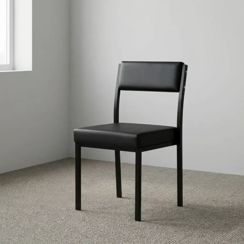 Stackable catalina waiting chair featuring black leatherette upholstery over a padded seat cushion and a matching padded mid-back backrest, an armless space-saving frame design, and a heavy-duty black powder-coated square steel four-legged base.