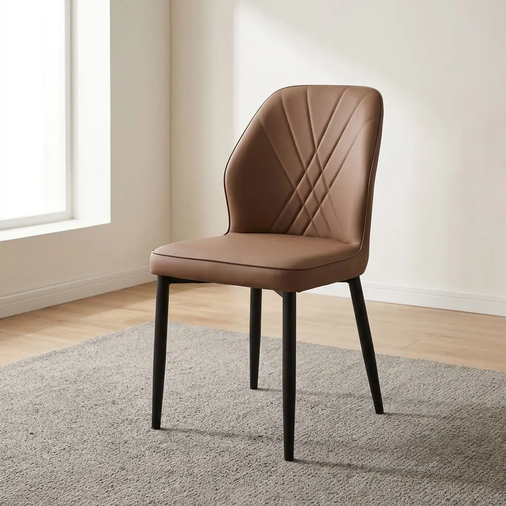Brown leather dining chair featuring supple light tan-brown leatherette upholstery with cross-hatched accent stitching along the curved inner backrest, a cushioned contoured seat, an armless side chair profile, and matte black powder-coated steel tapered legs.