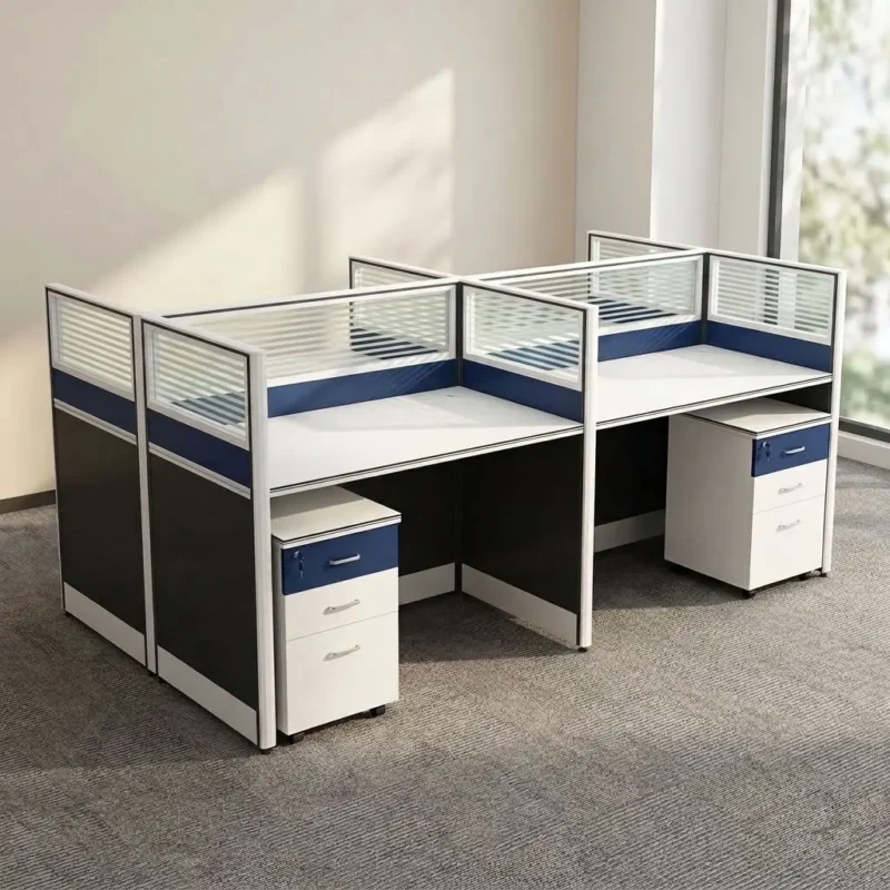 Spacious 4-way workstation featuring white laminate rectangular desktops, integrated dual-tone blue and dark grey partition panels topped with frosted glass accents, four mobile 3-drawer lockable pedestals with blue top drawer accents and silver bow handles, supported by a heavy-duty steel frame structure with full-height modesty panels.